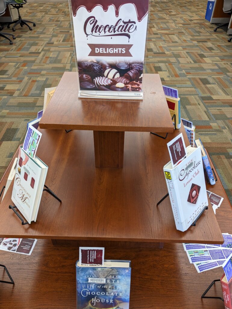 Library display with books about chocolate.